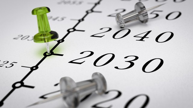 Year 2030 written on a paper with a green pushpin, concept image for business vision or long term prospective. Number two thousand thirty. 
