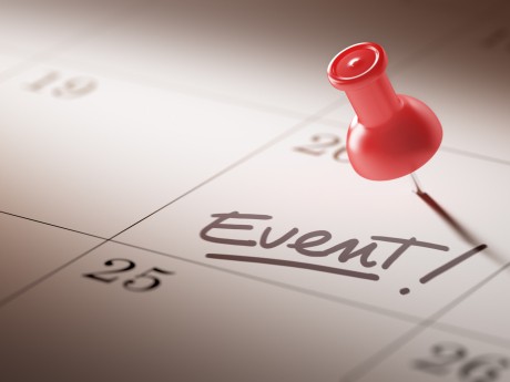 Concept image of a Calendar with a red push pin. Closeup shot of a thumbtack attached. The words Event written on a white notebook to remind you an important appointment.